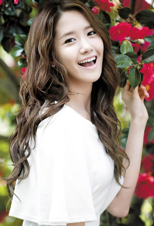 桃心脸女生卷中长发造型 漂亮流行的女生烫发图片