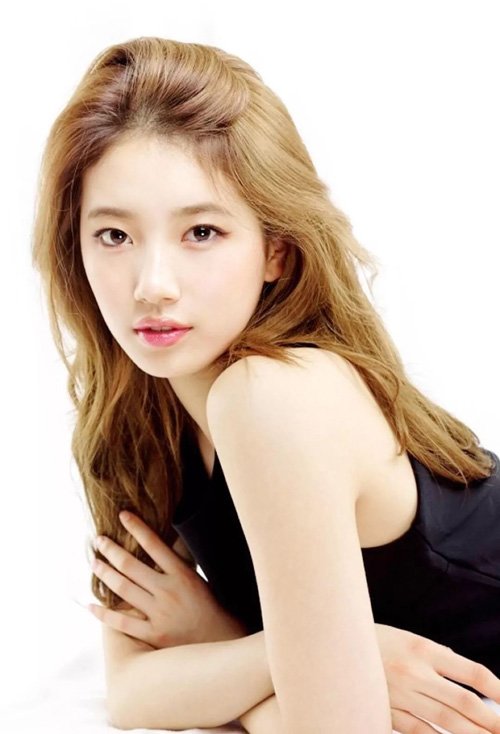 桃心脸女生卷中长发造型 漂亮流行的女生烫发图片